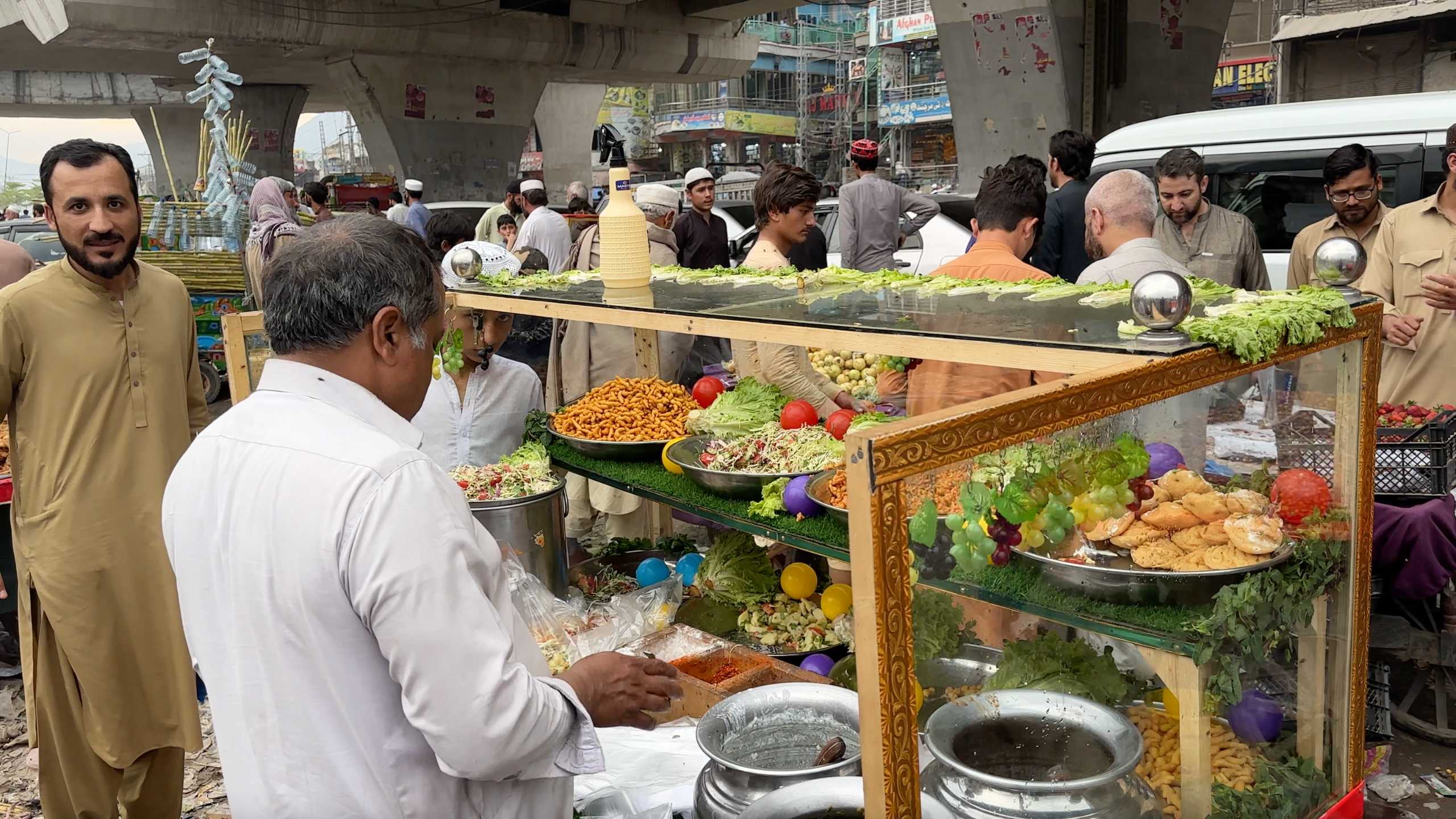 A vibrant salad and snack stall, attracting curious onlookers and customers.