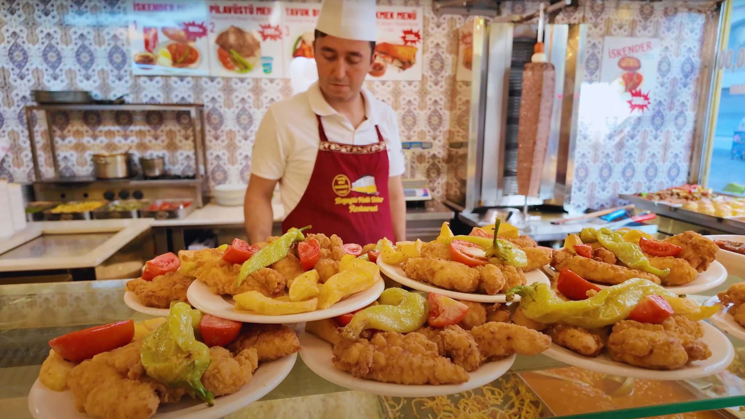 Plates of golden fried fish and fresh vegetables, ready to delight hungry visitors.