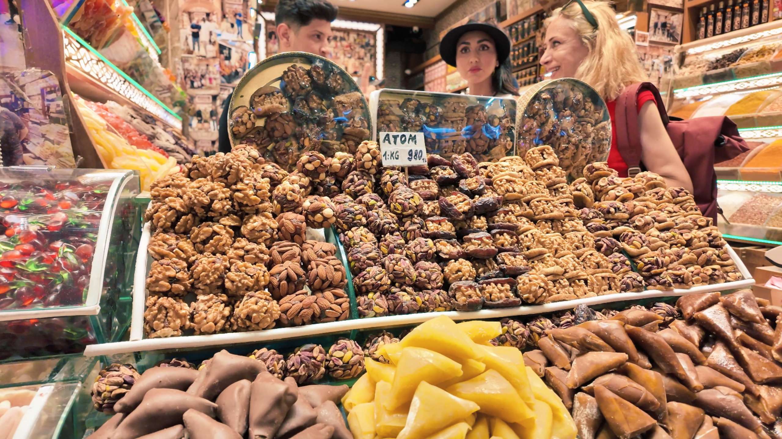 A variety of sweet Turkish treats stacked high, tempting passersby.