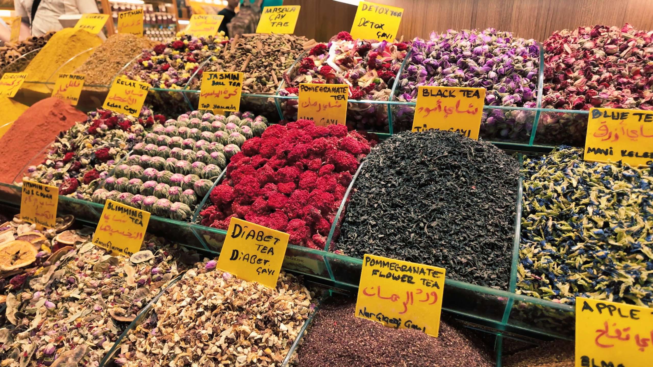 Beautifully arranged herbal teas and spices, with hand-written labels.