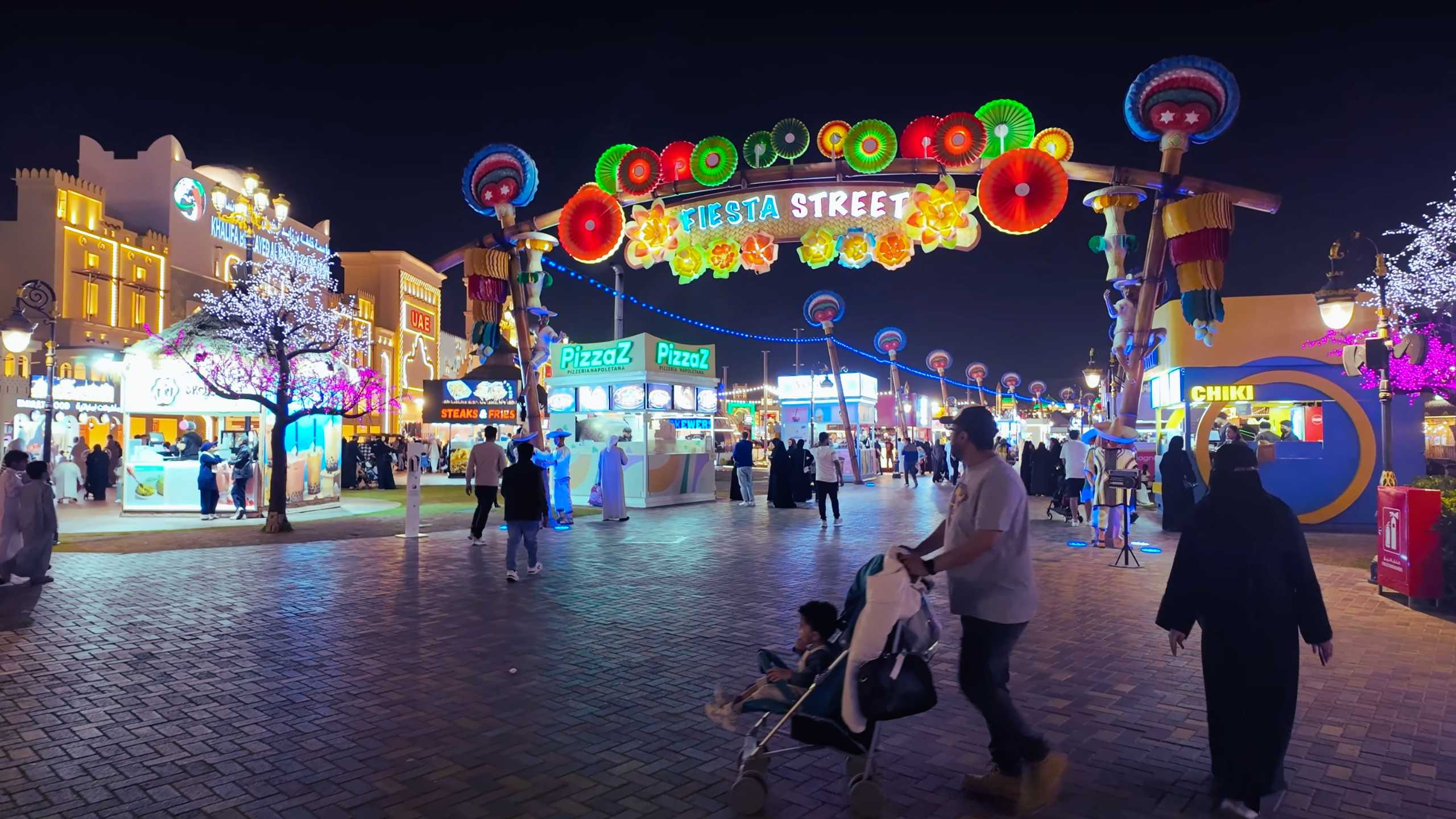 Fiesta Street shines with vibrant colors and festive decorations.