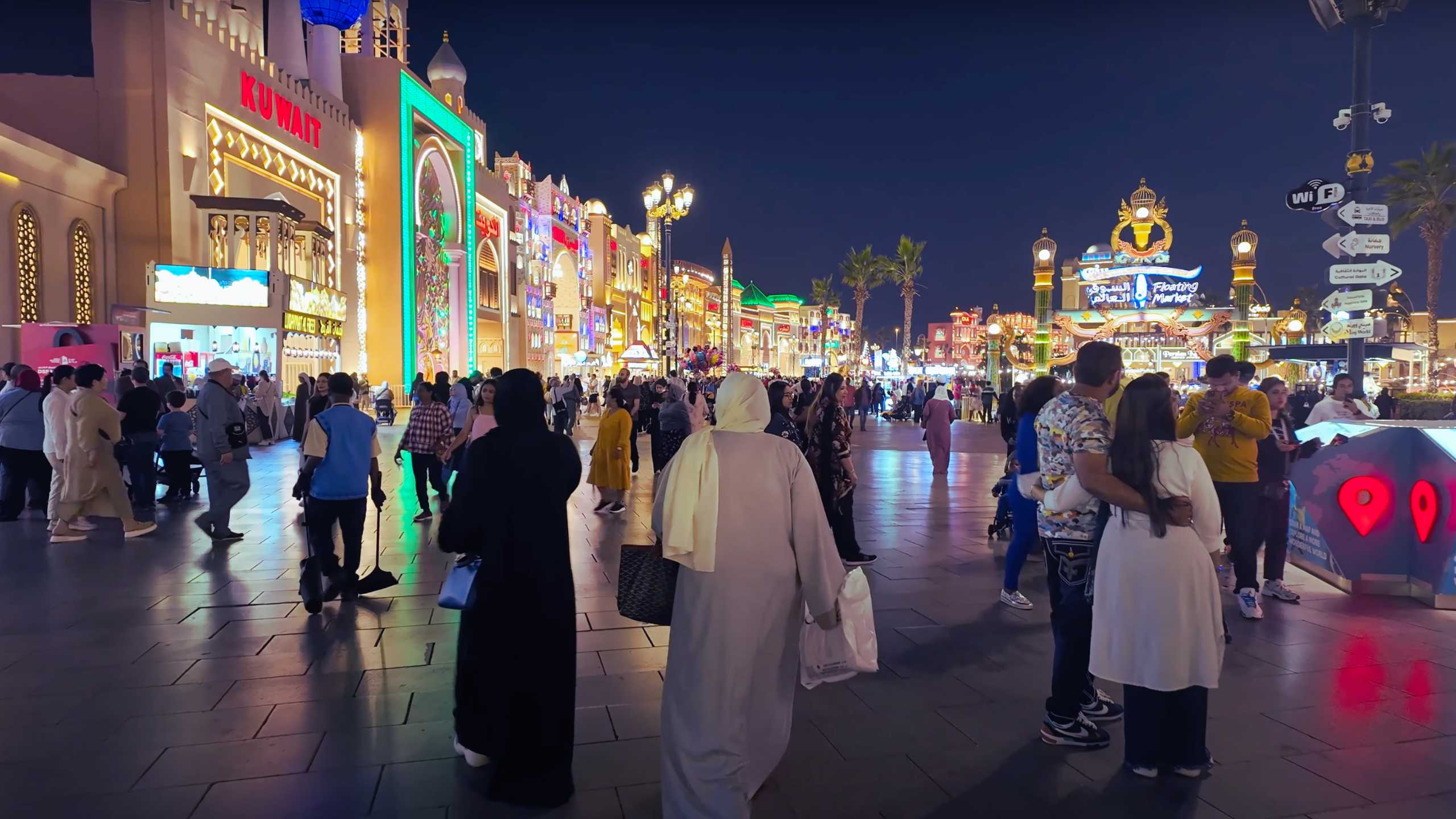 Bustling evening in a colorful place, rich in lights and energy.