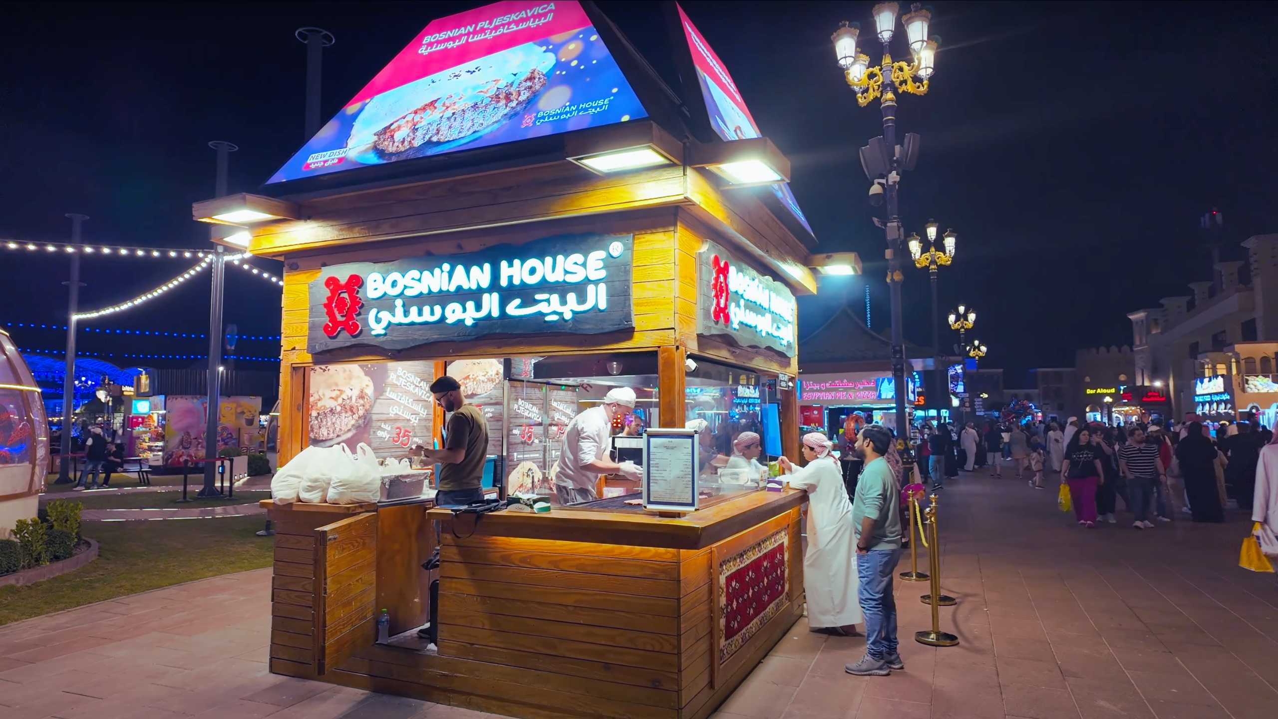 A cozy food stall serving up Bosnian delights to eager customers.