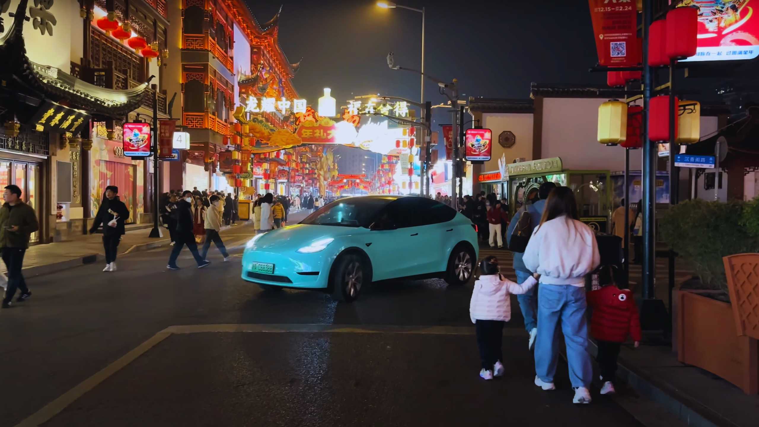 Yuyuan Bazaar, bustling with people and colorful lights.