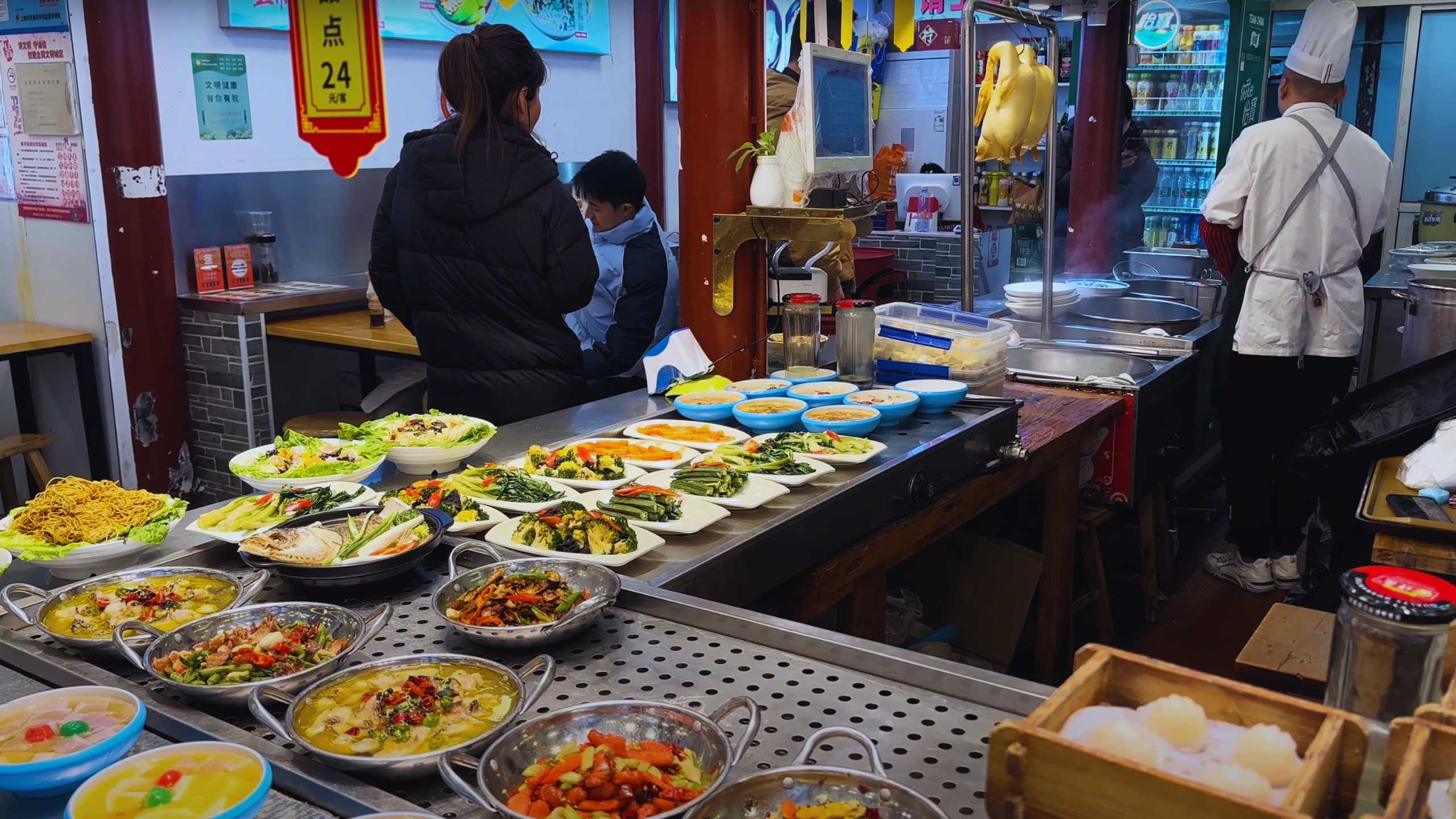 An array of vibrant dishes displayed at a local food vendor's stall, offering a feast for the eyes.