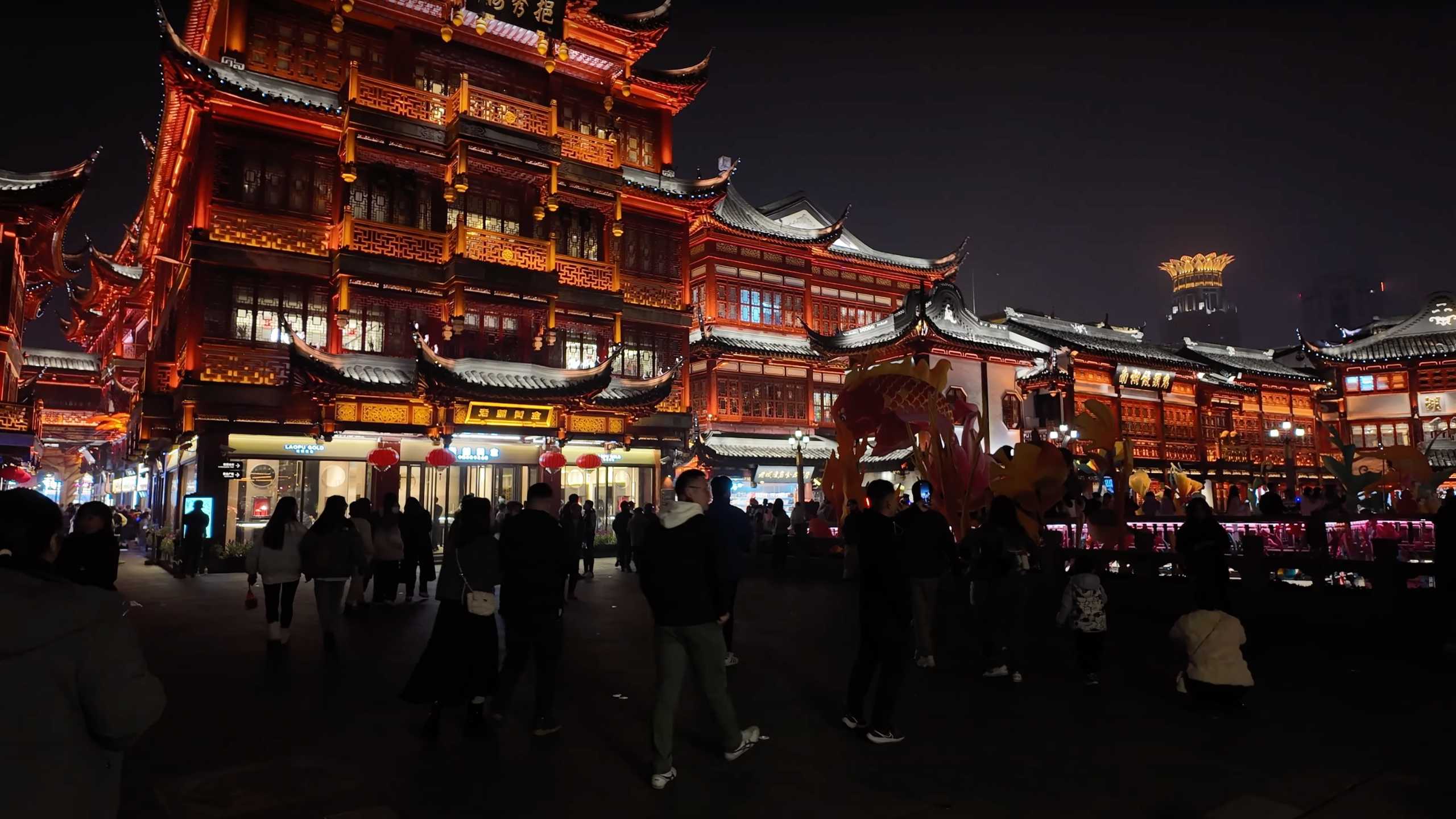 Stunning view of traditional Chinese architecture illuminated during the night.