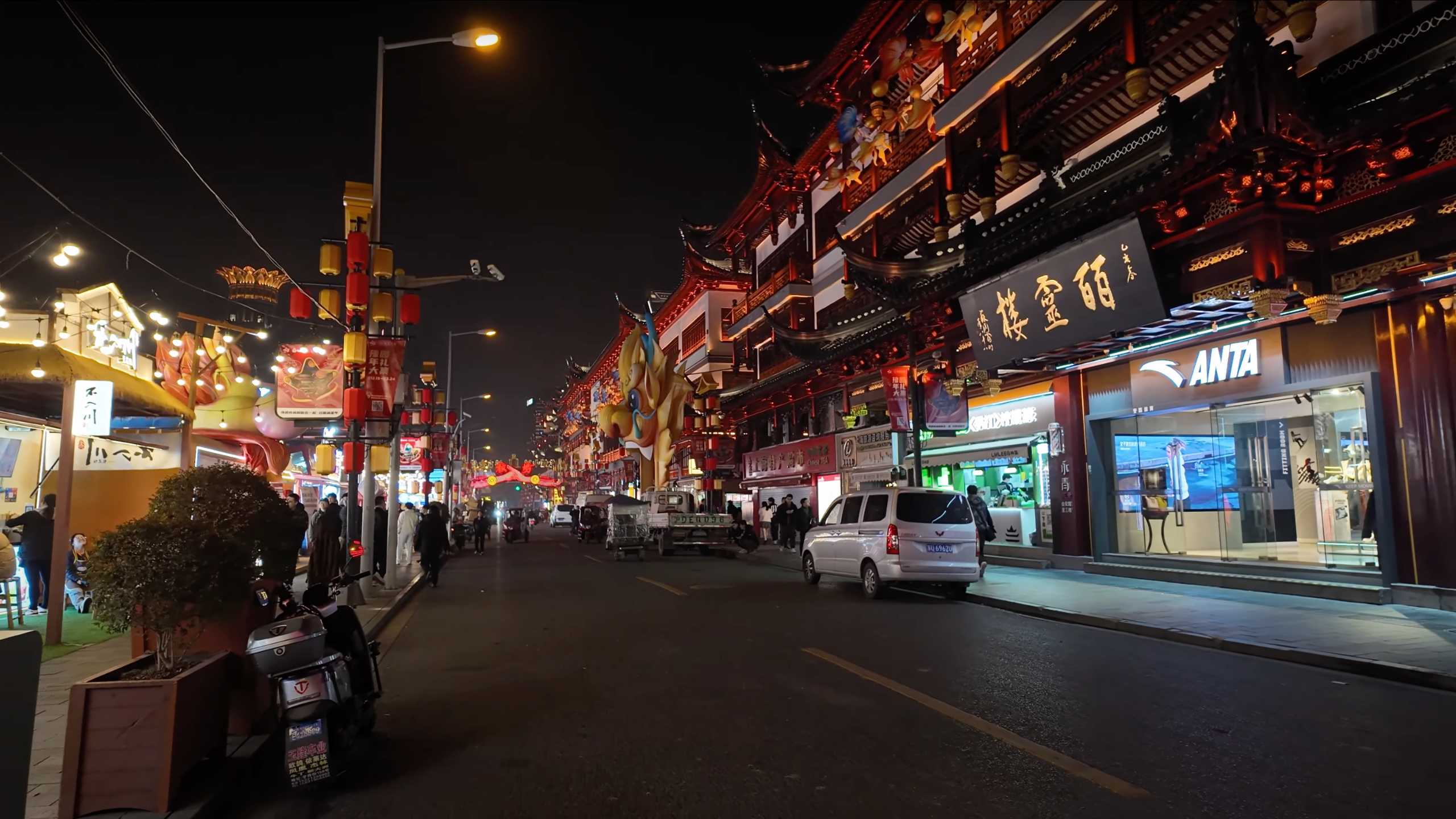 Busy street lined with traditional architecture and modern stores.