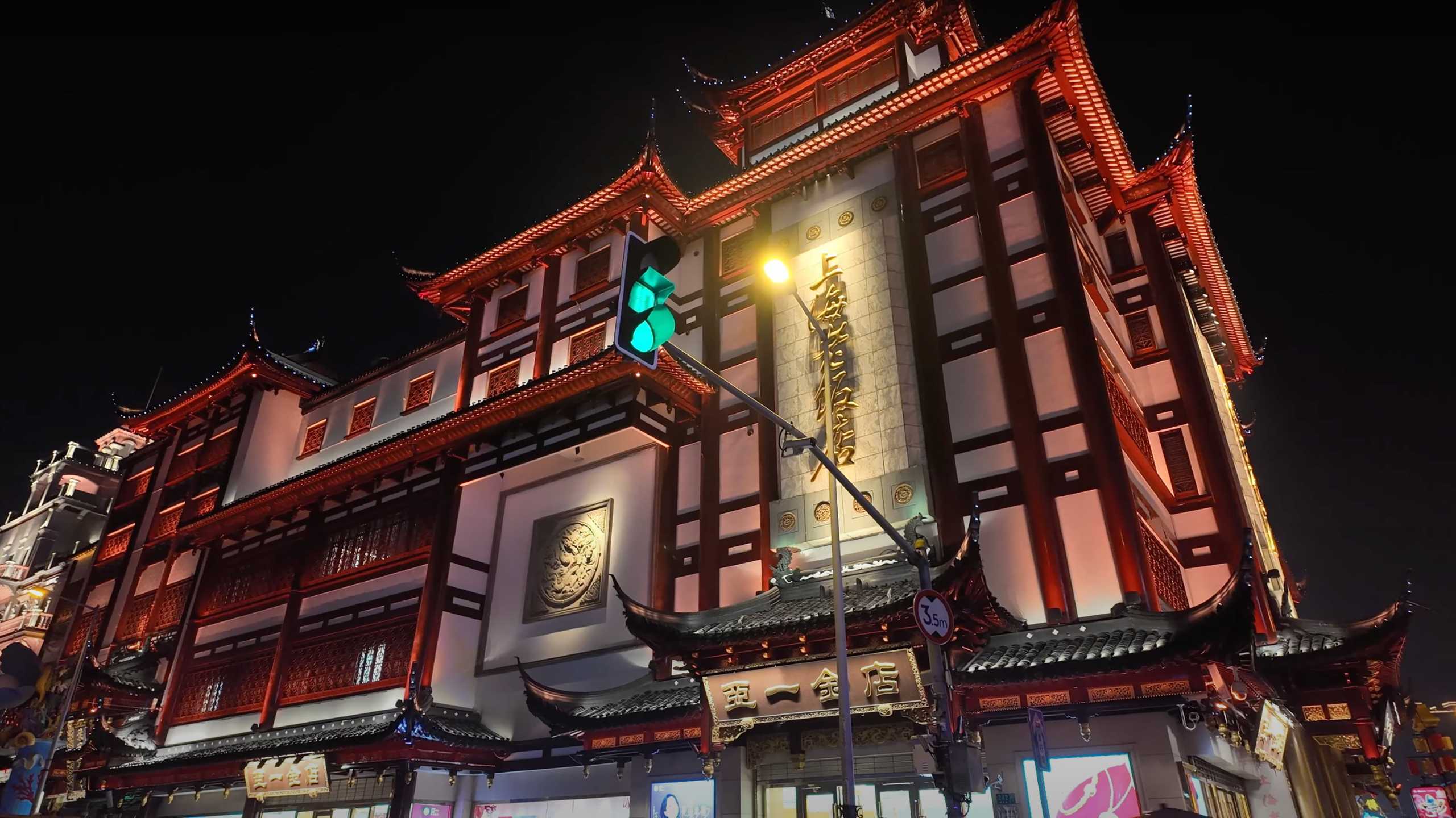 Elegant architecture glowing with warm lights against the night sky.