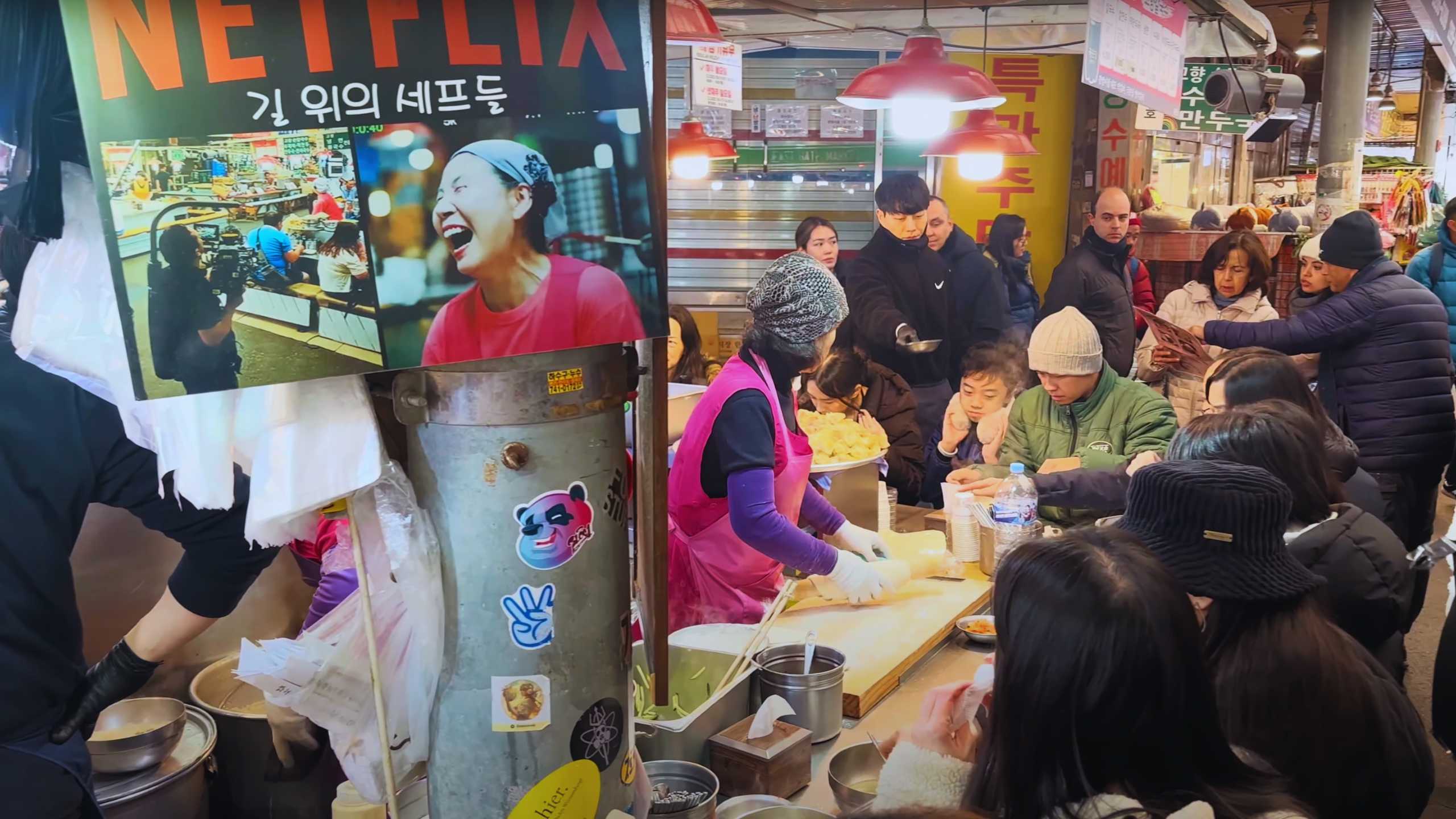 A popular food stall featured on Netflix, crowded with locals and tourists alike.