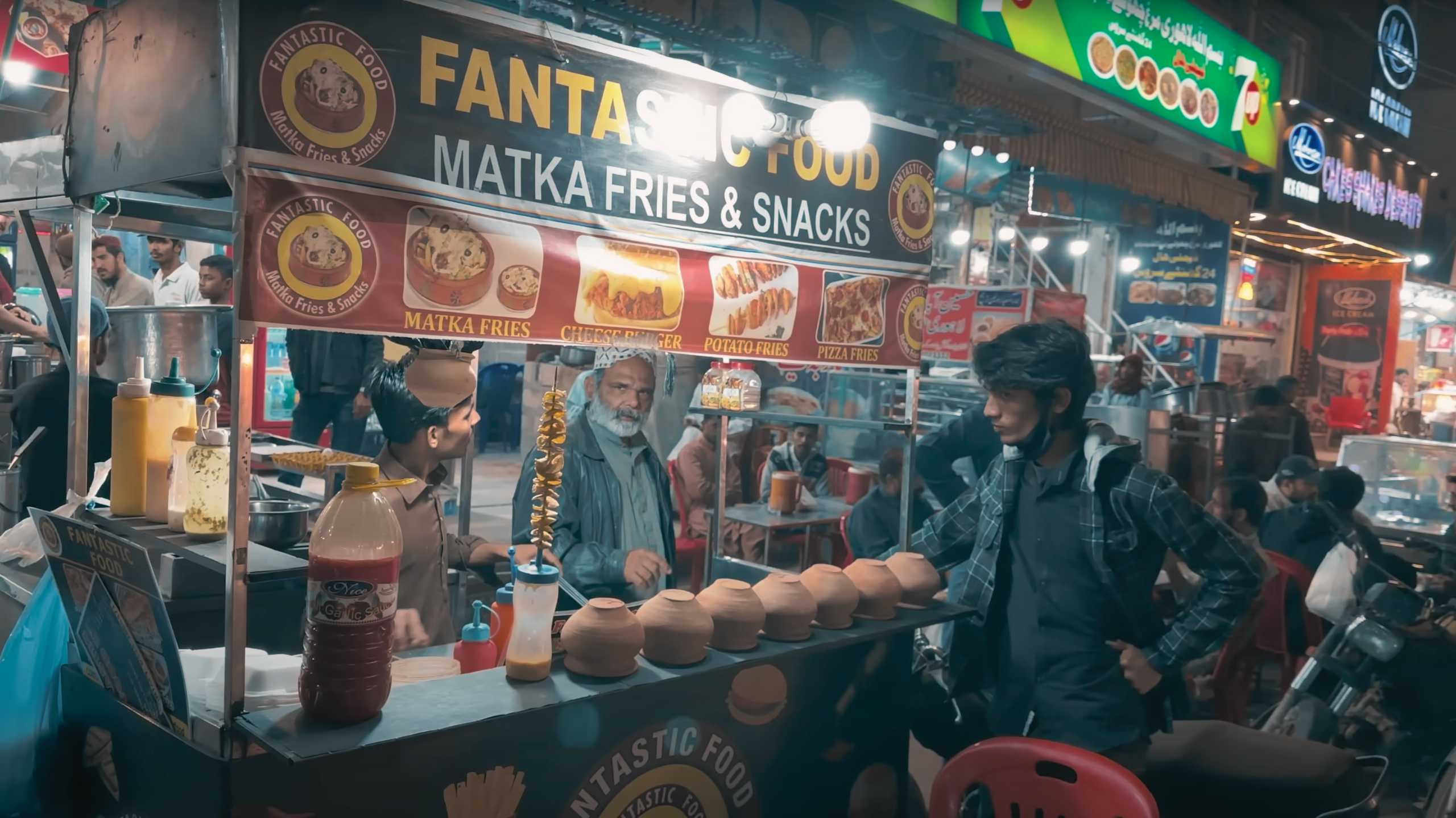 A vibrant stall offering a variety of snacks served in traditional clay pots.