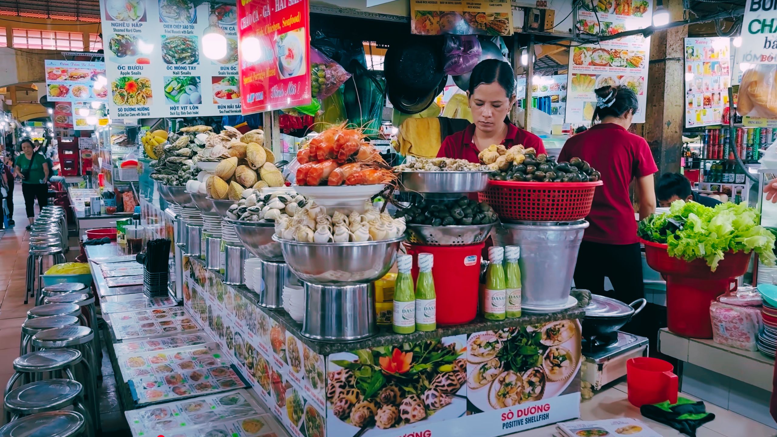 Fresh seafood and local dishes are prepared by women in vibrant market kitchens.